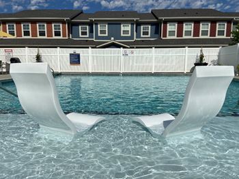 Pool shelf with white chairs